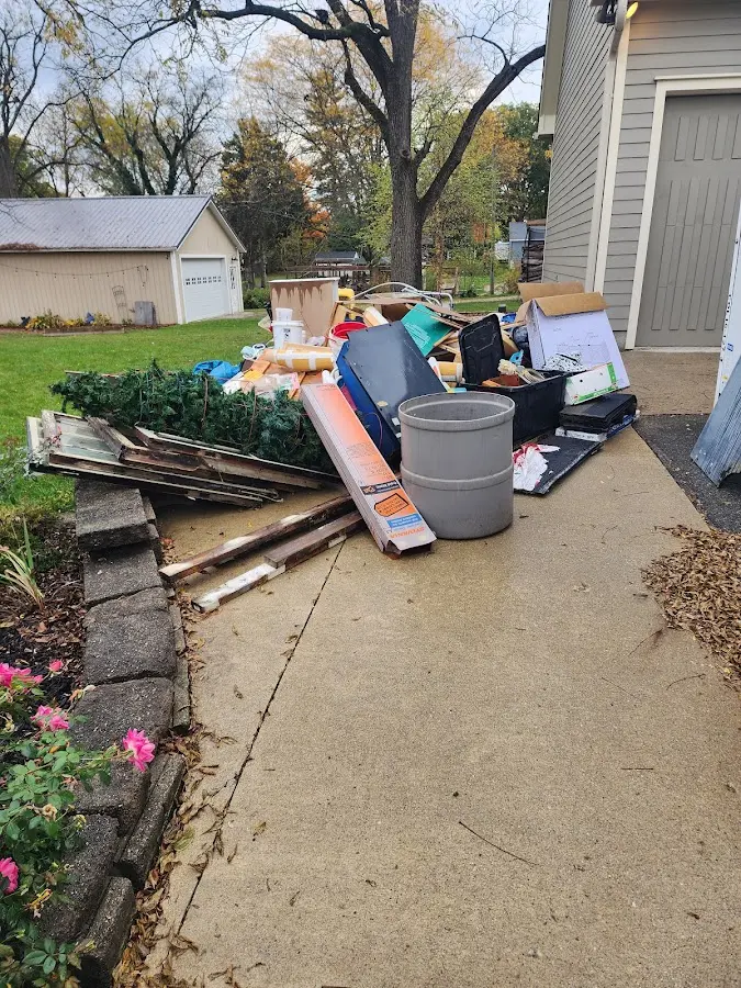 Dumpster being loaded with debris for Commercial Dumpster Rental in Southchase